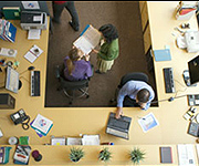 Office space with wireless printers, laptops, and PCs